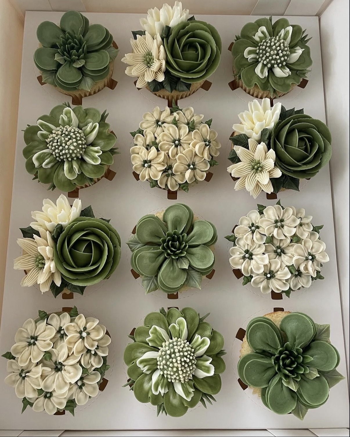 Hand-piped floral cupcakes by The Cupcake Sensation