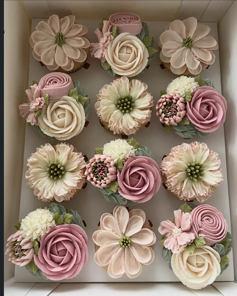 Hand-piped floral cupcakes by The Cupcake Sensation