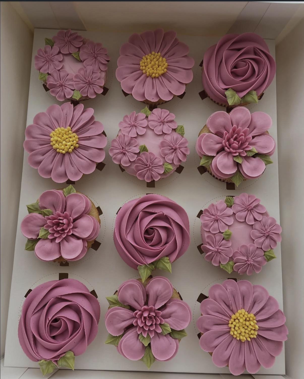 Hand-piped floral cupcakes by The Cupcake Sensation