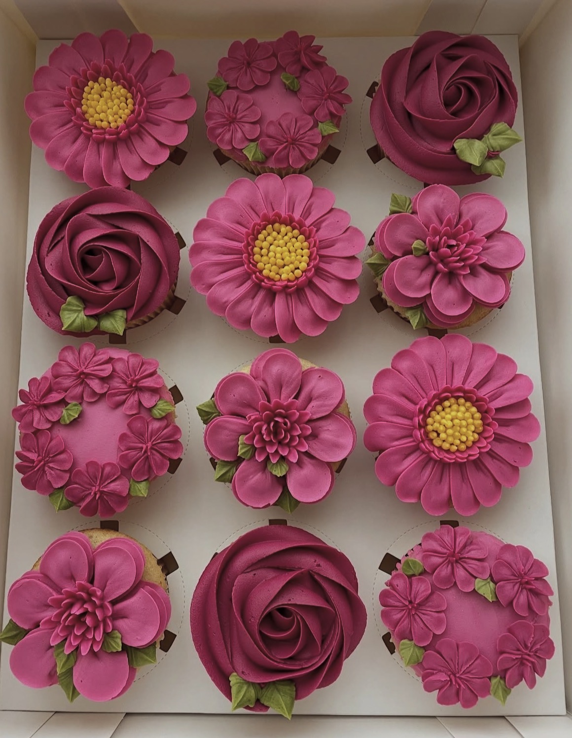 Hand-piped floral cupcakes by The Cupcake Sensation